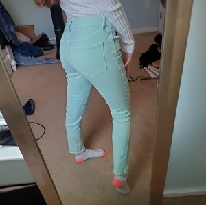 Mint green ripped jeans